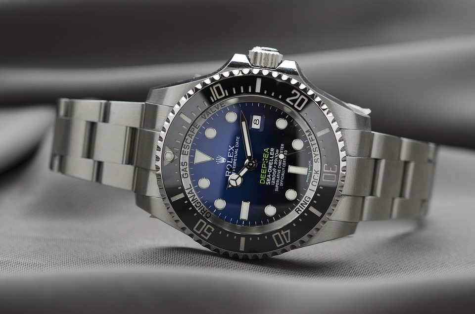 Rolex best sale parent company